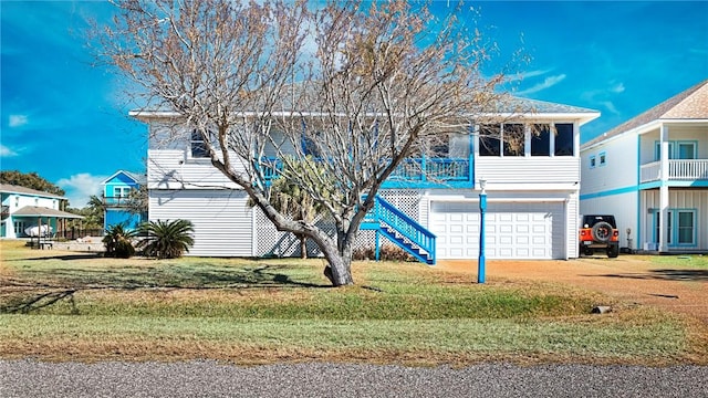 view of front facade with a front lawn and a garage