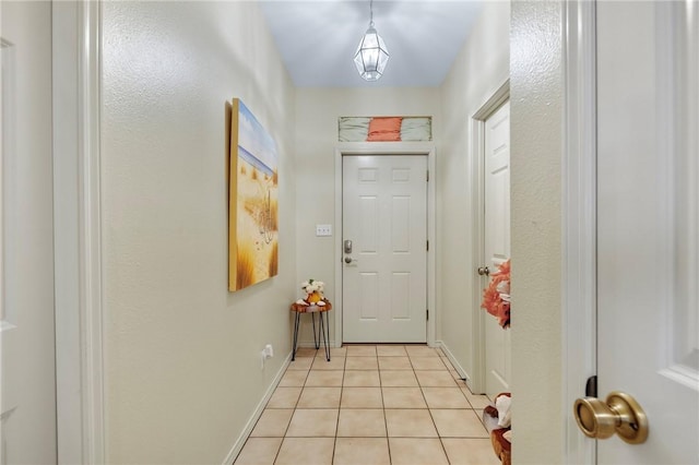 doorway to outside featuring light tile patterned floors