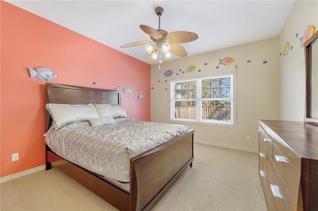 bedroom with light carpet and ceiling fan