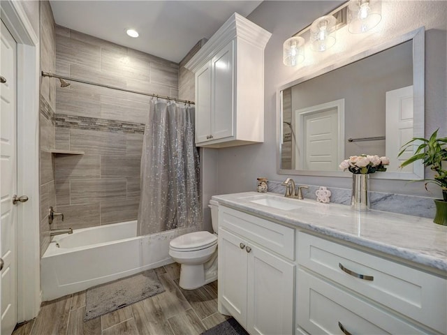 full bathroom with shower / bath combination with curtain, toilet, vanity, and wood tiled floor