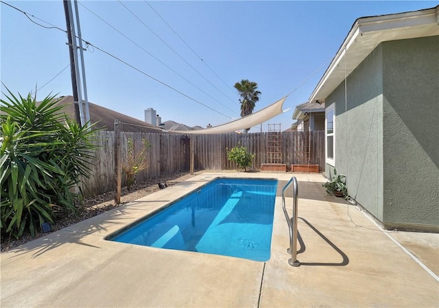 view of swimming pool with a fenced in pool, a patio, and a fenced backyard