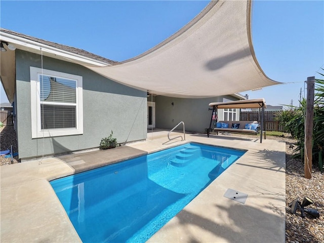 view of pool with a fenced in pool, a patio area, and fence