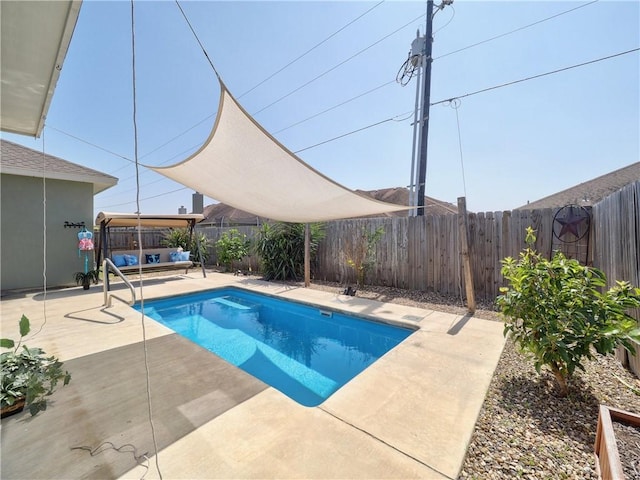 view of swimming pool with a patio area, a fenced backyard, and a fenced in pool