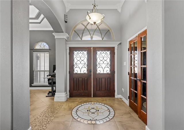 8245 Rock Crest Dr, Corpus Christi, TX 78414 - foyer featuring crown molding, arched walkways, a high ceiling, and french doors