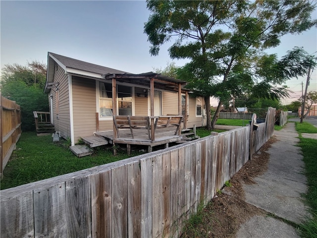 view of front of property featuring a wooden deck