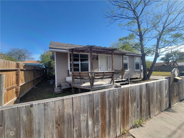 view of front of home featuring a wooden deck