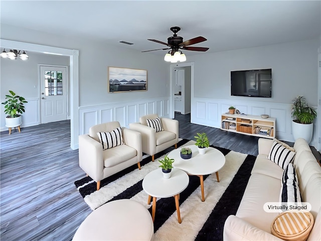 6042 Hugo Dr, Corpus Christi, TX 78412 - living room with wood finished floors, a ceiling fan, wainscoting, and a decorative wall