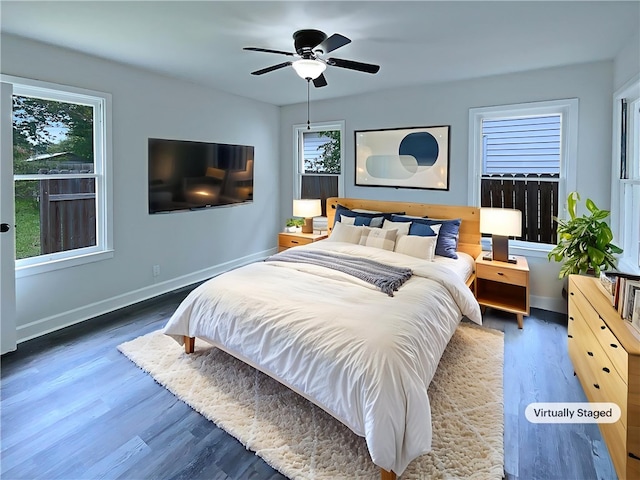 6042 Hugo Dr, Corpus Christi, TX 78412 - bedroom featuring multiple windows, wood finished floors, baseboards, and a ceiling fan