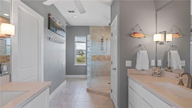 bathroom with tile patterned floors, vanity, ceiling fan, and an enclosed shower