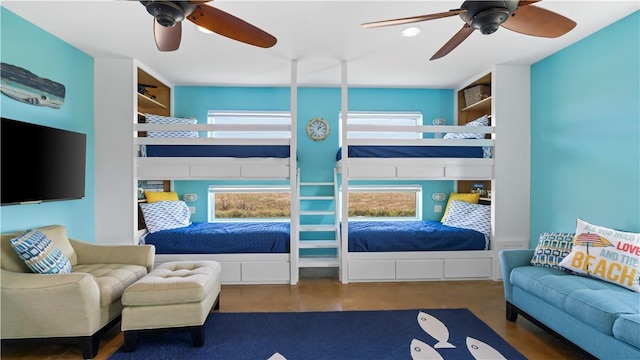 bedroom with ceiling fan and dark hardwood / wood-style floors