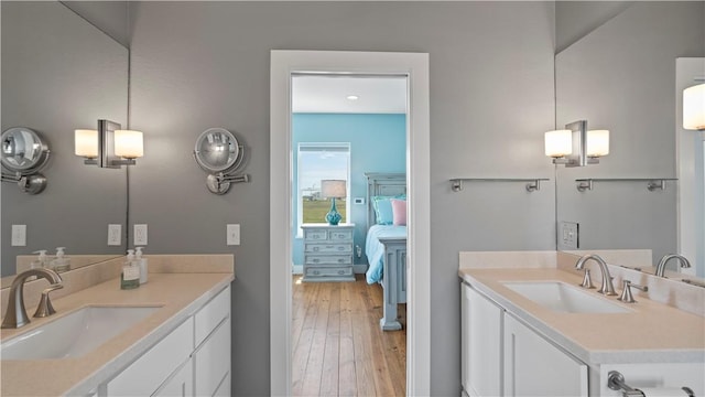 bathroom featuring vanity and wood-type flooring