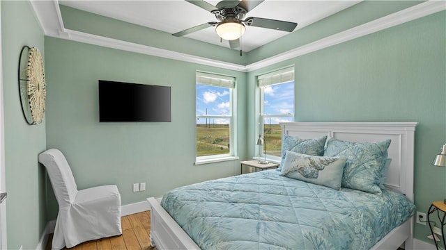 bedroom with light hardwood / wood-style floors and ceiling fan