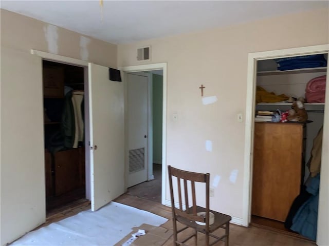 bedroom with hardwood / wood-style floors