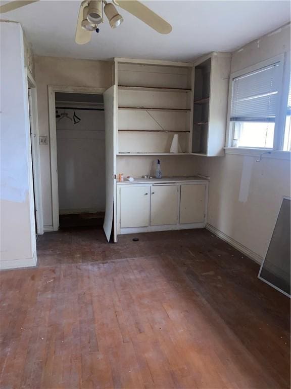 kitchen with ceiling fan and wood-type flooring