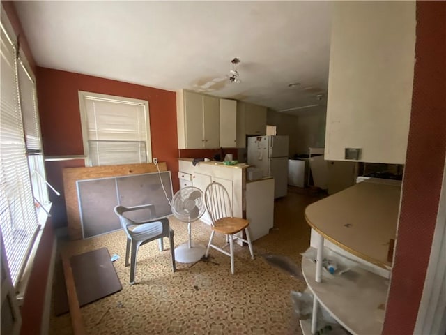 kitchen featuring white fridge