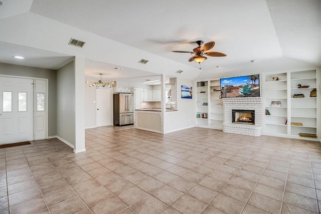 13810 Mizzen St, Corpus Christi, TX 78418 - unfurnished living room with a fireplace, light tile patterned floors, a ceiling fan, built in shelves, and baseboards