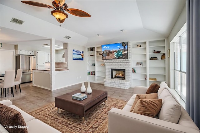 13810 Mizzen St, Corpus Christi, TX 78418 - living area featuring light tile patterned flooring, lofted ceiling, a ceiling fan, built in features, and a fireplace