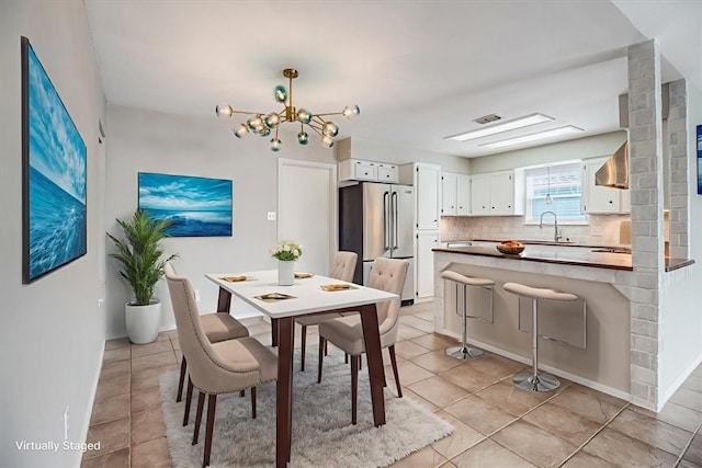 13810 Mizzen St, Corpus Christi, TX 78418 - dining room featuring light tile patterned floors and a chandelier