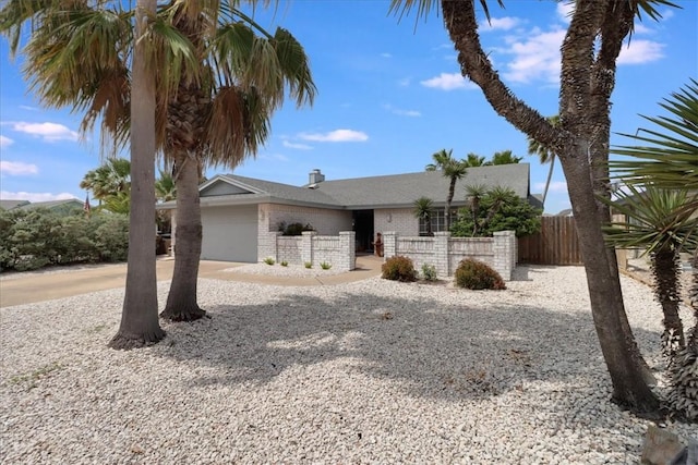 13810 Mizzen St, Corpus Christi, TX 78418 - view of front of house with brick siding, an attached garage, concrete driveway, and a chimney
