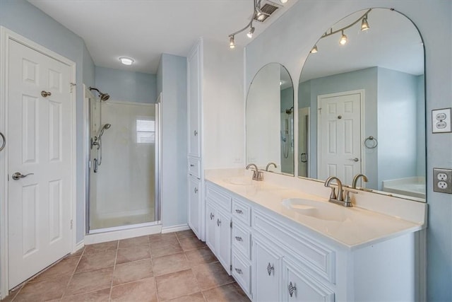 13810 Mizzen St, Corpus Christi, TX 78418 - bathroom featuring a stall shower, double vanity, tile patterned flooring, and a tub