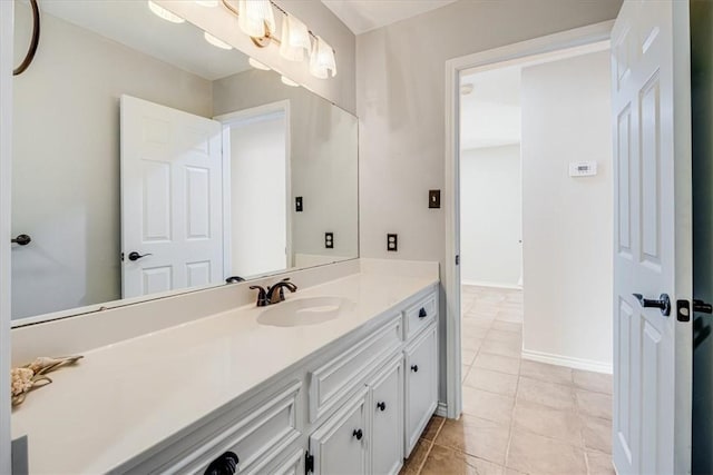 13810 Mizzen St, Corpus Christi, TX 78418 - bathroom with vanity, tile patterned flooring, and baseboards