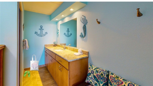 bathroom with wood-type flooring and vanity