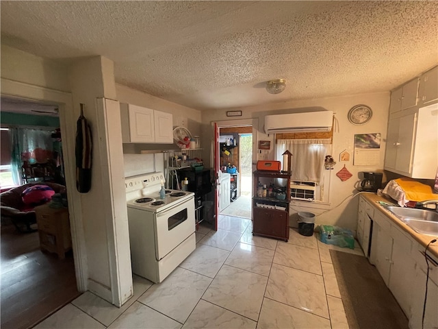 kitchen with sink, white cabinets, white electric range oven, and a textured ceiling