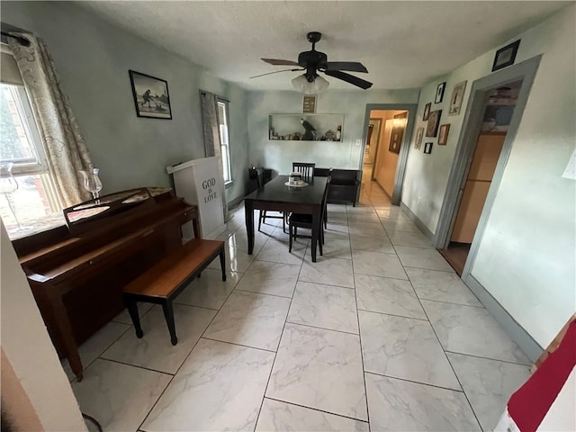 dining area with ceiling fan