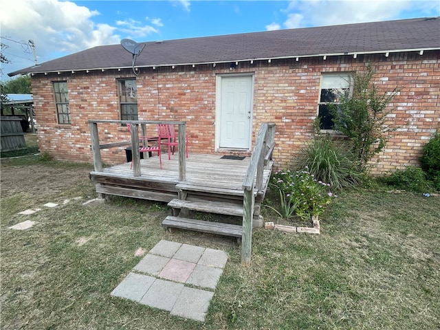 exterior space featuring a yard and a deck