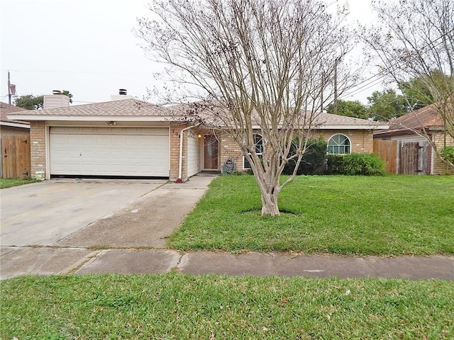 ranch-style house with a garage and a front lawn