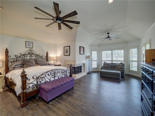 bedroom featuring dark wood-type flooring, lofted ceiling, ceiling fan, and crown molding