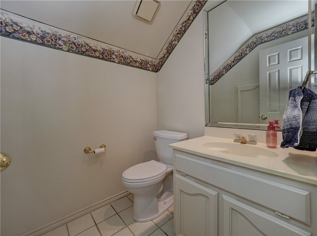 bathroom featuring toilet, vanity, and tile patterned floors