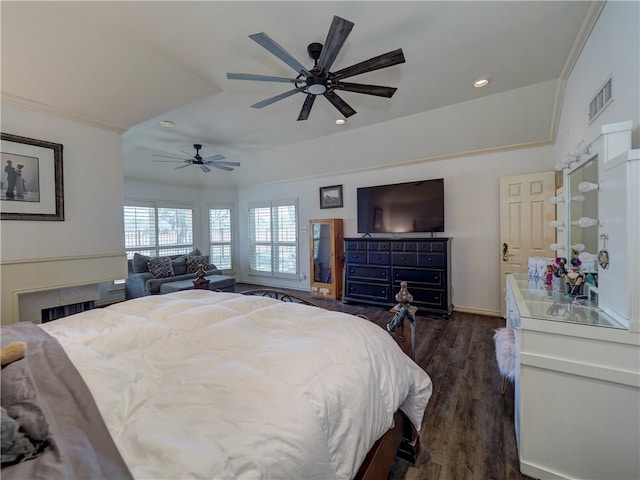 bedroom featuring crown molding, ceiling fan, and dark hardwood / wood-style floors