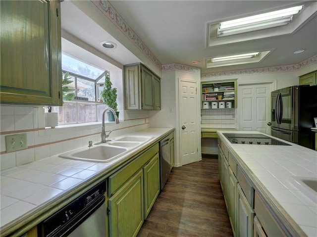 kitchen featuring tile countertops, black appliances, dark wood-type flooring, and sink