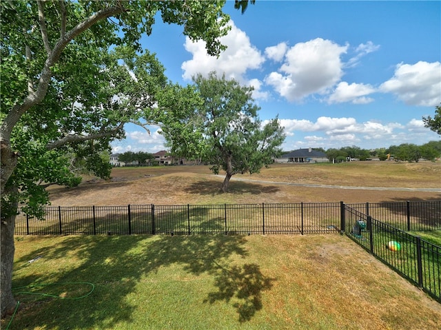 view of yard with a rural view