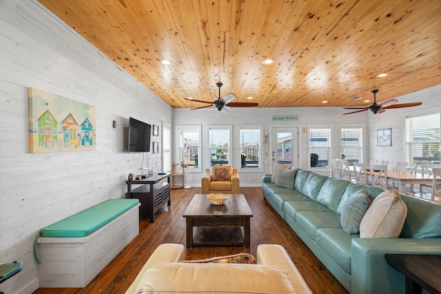 living room with dark hardwood / wood-style flooring, a wealth of natural light, and wood ceiling