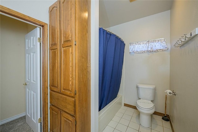 505 Spyglass St, Rockport, TX 78382 - full bathroom with toilet, baseboards, a closet, tile patterned floors, and shower / bath combination with curtain