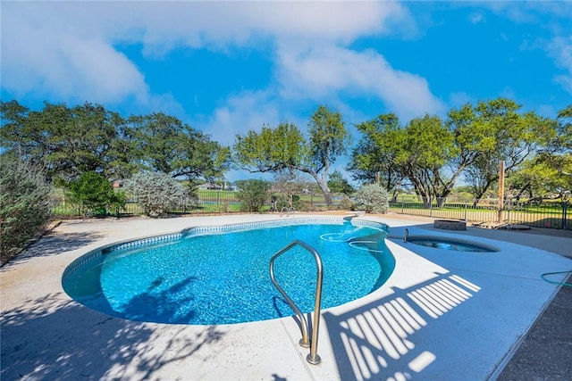 505 Spyglass St, Rockport, TX 78382 - view of swimming pool featuring a fenced in pool, fence, and an in ground hot tub