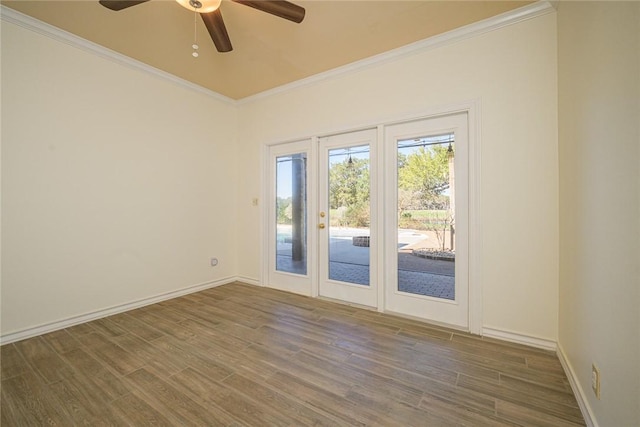 505 Spyglass St, Rockport, TX 78382 - spare room featuring dark wood-style floors, ornamental molding, baseboards, and ceiling fan