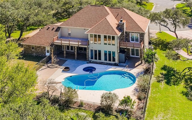 view of swimming pool featuring a fenced in pool, a patio, an in ground hot tub, fence, and a wooden deck