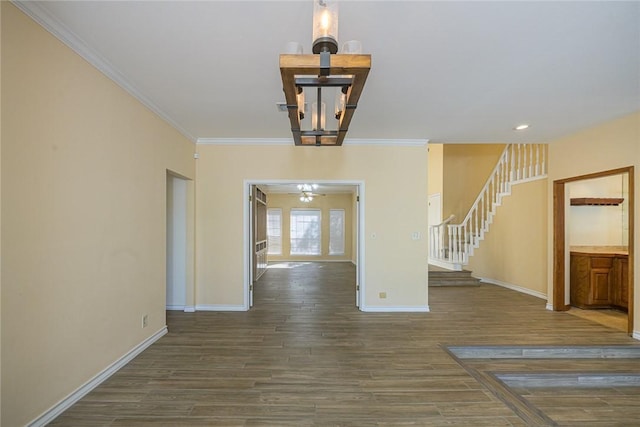 505 Spyglass St, Rockport, TX 78382 - empty room featuring ornamental molding, dark wood finished floors, stairway, and baseboards