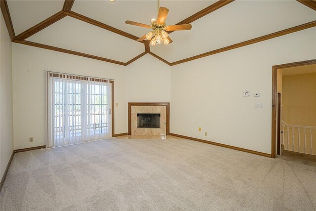 505 Spyglass St, Rockport, TX 78382 - unfurnished living room with light carpet, a fireplace, high vaulted ceiling, and crown molding