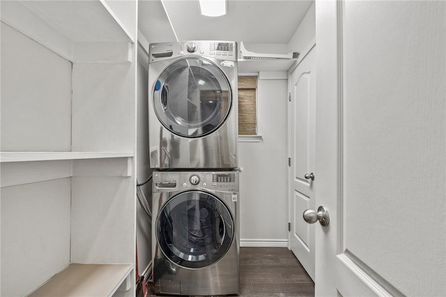 washroom featuring estacked washer and dryer and wood finished floors