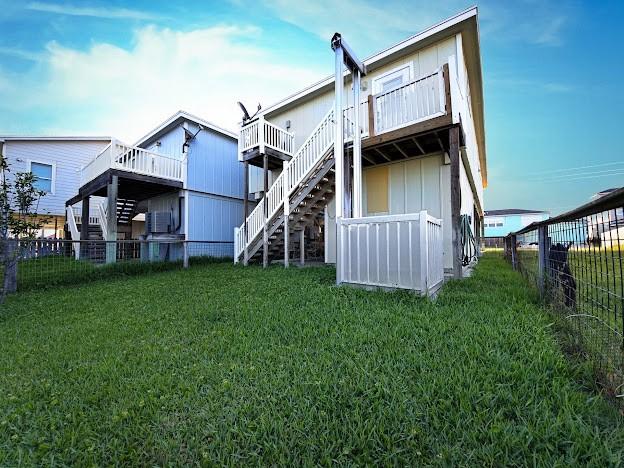 back of property with stairway and a wooden deck
