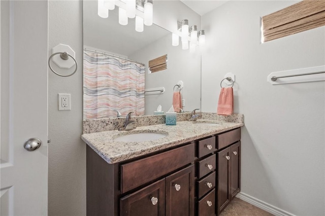 bathroom featuring double vanity