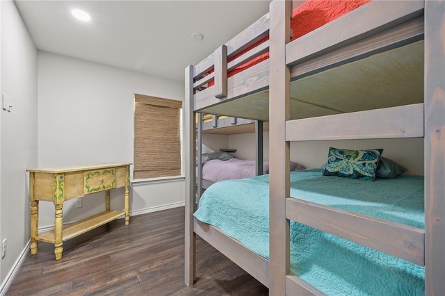bedroom with wood finished floors, baseboards, and recessed lighting