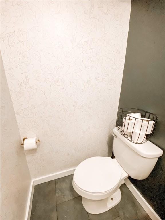 1801 Clare Dr, Alice, TX 78332 - bathroom with toilet, baseboards, and tile patterned floors
