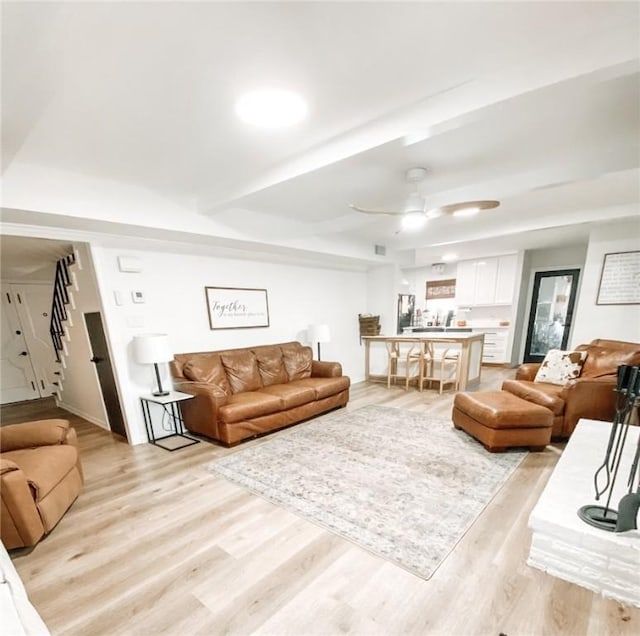 1801 Clare Dr, Alice, TX 78332 - living area featuring light wood finished floors, stairway, and a ceiling fan