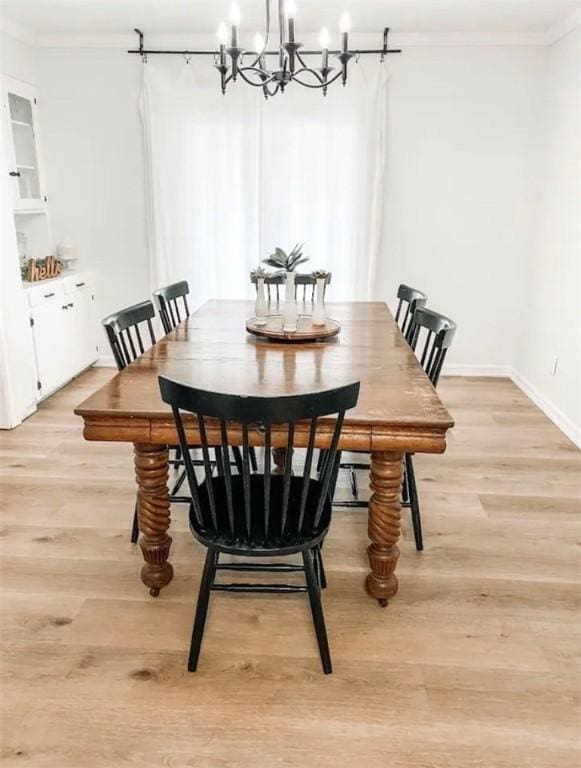1801 Clare Dr, Alice, TX 78332 - dining space with ornamental molding, a chandelier, light wood-style floors, and baseboards