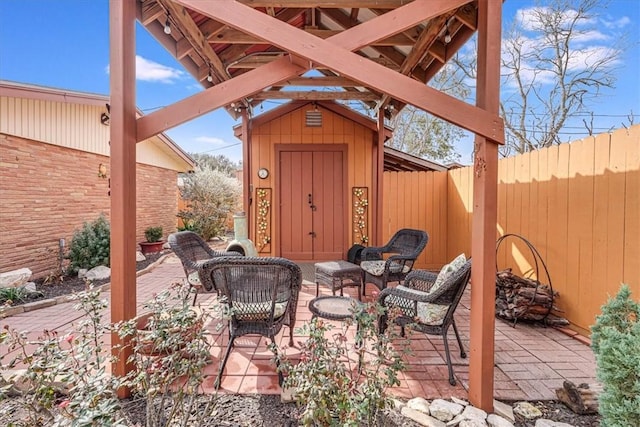 view of patio with a shed